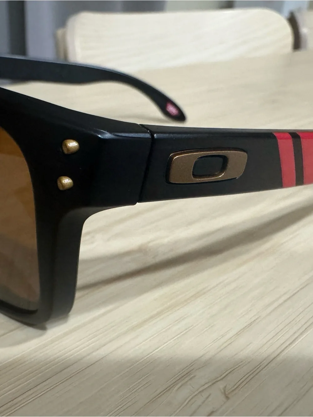 Oakley Black Sunglasses with Red Stripe and Gold Hardware